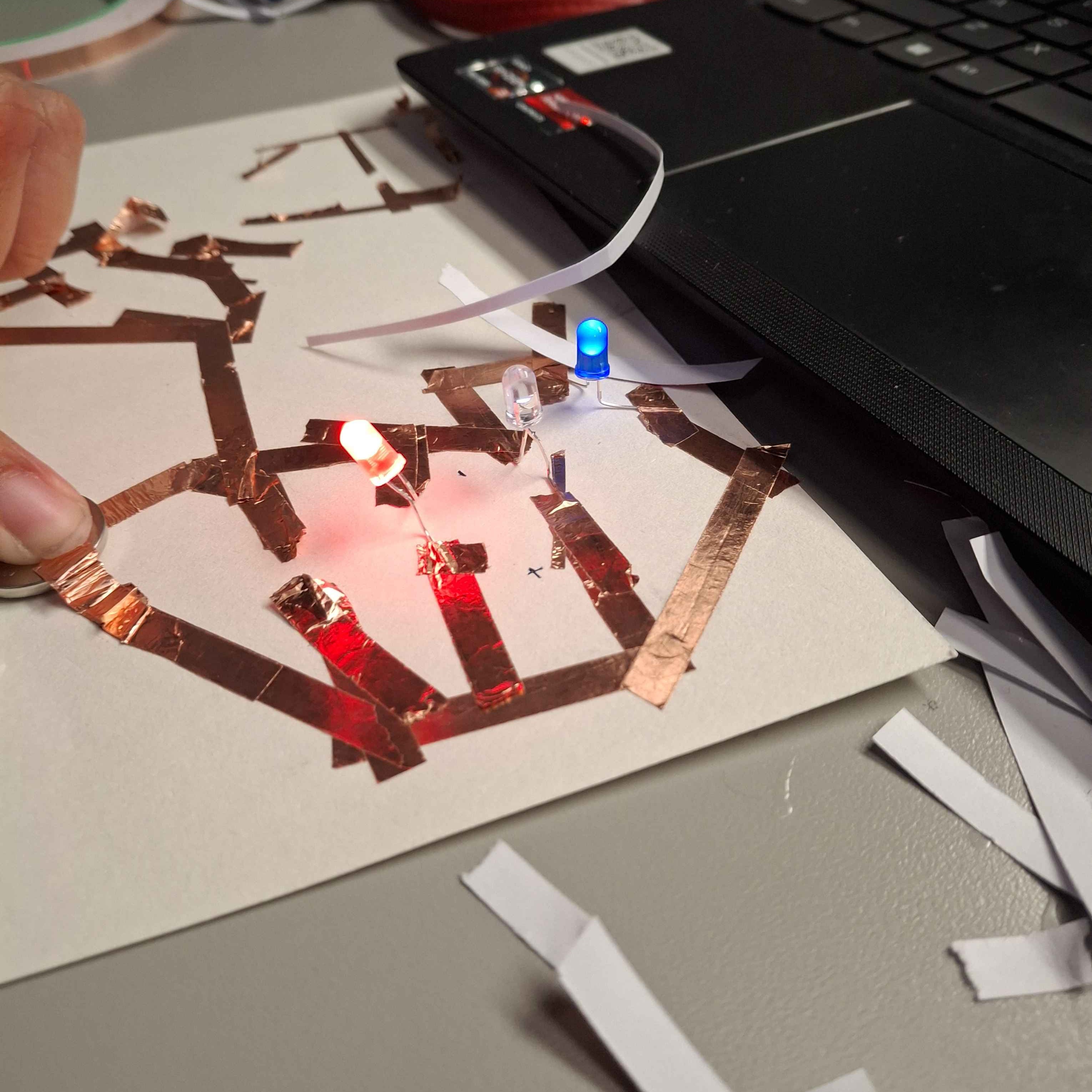 For some reasons, my first few circuts were rather weak, the power was not being distributed evenly within the copper tape circut. Some of the lights that I had connected lit up brighter than others, I assumed this was either the electricity not being transferred cleanly or the LED lights were on backwards.