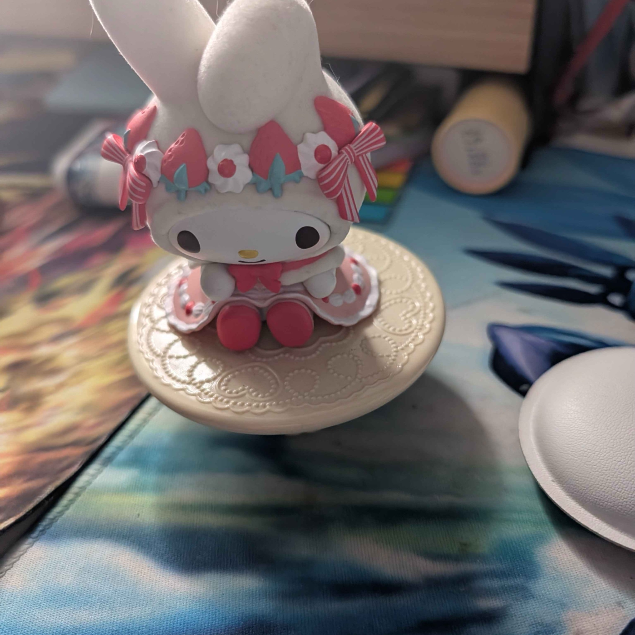 Basica angle of the figurine. I display a lot of figures and acrylic standees in my bedroom, but it's difficult to have substantial lighting due to how much space having several of these items can have. 